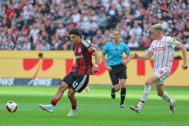 Can Uzun of Eintracht Frankfurt, No. 42, in a footrace with Matthias Ginter of SC Freiburg, 28, Eintracht Frankfurt vs. SC Freiburg, Bundesliga, BL, 2026–2027 season, Match 4, September 19, 2026, Frankfurt, Deutsche Bank Park, Germany