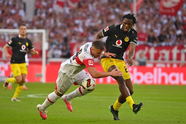 Joane GADOU, Borussia Dortmund, in action, tackling Ermedin DEMIROVIC, VFB Stuttgart, Soccer, 1. Bundesliga, 2026–2027 season, Matchday 4, Matchday 04, VfB Stuttgart vs. Borussia Dortmund on September 19, 2026, MHP ARENA