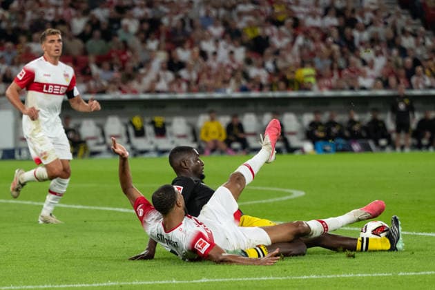 September 19, 2026, GER, Soccer, Men s, Bundesliga 1, 2026–2027 Season, Matchday 4, VfB Stuttgart vs. Borussia Dortmund: Josha Vagnoman (VfB Stuttgart, No. 04) and Serhou Guirassy (Borussia Dortmund, No. 09) in a tackle. DFB and DFL regulations prohibit any use of photographs as image sequences and or quasi-video. Stuttgart MHP Arena, Baden-Württemberg, Germany Copyright: xNordphoto WolfgangxFrankx