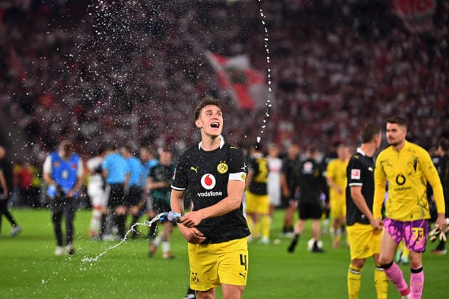 Maximilian BEIER of Borussia Dortmund celebrates at the final whistle, spraying water from a bottle; celebration, joy, excitement, action, single frame, cropped close-up, half-length shot, soccer, 1. Bundesliga, 2026–2027 season, Matchday 4, Matchday 04, VfB Stuttgart vs. Borussia Dortmund 0–1 on September 19, 2026, MHP ARENA