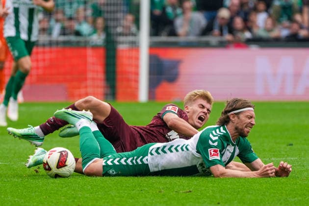 Hennes Behrens (FC Augsburg), No. 16, committing a foul on Mitchell Weiser (Werder Bremen), No. 8; facial expression, facial gestures, emotion; German soccer, Bundesliga, 2026–27 season, Matchday 4, September 19, 2026; Werder Bremen vs. FC Augsburg, Weserstadion, Bremen Copyright: xLeonxFrickx
