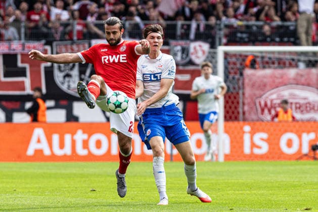3rd Division, Matchday 7: Rot-Weiss Essen vs. Hansa Rostock, September 20, 2026; Peter Kiedl, Hansa Rostock, 29, Jose Enrique Rios Alonso, Rot-Weiss Essen, 23, 3rd Division, Matchday 7: Rot-Weiss Essen vs. Hansa Rostock, Stadion an der Hafenstraße, Essen, September 20, 2026. DFL regulations prohibit any use of photographs as image sequences and or quasi-video. Copyright: xBEAUTIFULxSPORTS Buriakovx