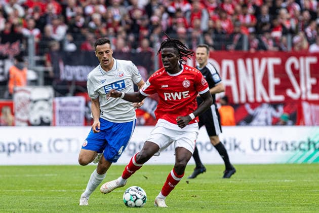 3rd Division, Matchday 7: Rot-Weiss Essen vs. Hansa Rostock, September 20, 2026, Kenan Fatkic (Hansa Rostock), 4, Franci Bouebari, Rot-Weiss Essen, 19 3rd Division, Matchday 7: Rot-Weiss Essen vs. Hansa Rostock at Stadion an der Hafenstraße, Essen, September 20, 2026. DFL regulations prohibit any use of photographs as image sequences and or quasi-video Copyright: xBEAUTIFULxSPORTS Buriakovx