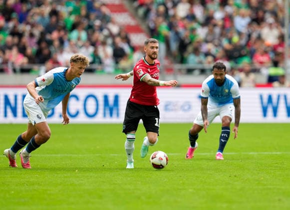 Tom Meyer, VfL Bochum 1848, 34, Marcel Hartel, Hannover 96, 10, and Sean Klaiber, VfL Bochum 1848, 2 GER, Hannover 96 vs. VfL Bochum 1848, 2. Bundesliga, Matchday 6, 2026–27 season, Heinz von Heiden Arena, Hannover, September 20, 2026 DFL regulations prohibit any use of photographs as image sequences and or quasi-video Hannover 96 vs. VfL Bochum 1848, 2. Bundesliga, Matchday 6, 2026–27 Season, September 20, 2026, Hannover Copyright: xEibner-Pressefoto ScottxColemanx EP_SCN