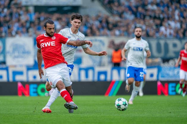 Jose Enrique Rios Alonso (Rot Weiss Essen, 23) in a tackle with Peter Kiedl (FC Hansa Rostock, 29) for the ball; Rot Weiss Essen vs. FC Hansa Rostock, soccer, 3rd Division, Matchday 7, 2026–27 season, September 20, 2026, DFL regulations prohibit any use of photographs as image sequences and or quasi-video, Rot-Weiss Essen vs. FC Hansa Rostock, Soccer, 3rd Division, Matchday 7, 2026–27 Season, September 20, 2026, Essen Copyright: xEibner-Pressefoto LukasxBaldygax EP_LBA