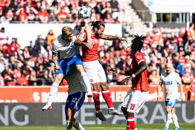 3rd Division, Matchday 7: Rot-Weiss Essen vs. Hansa Rostock, September 20, 2026; Andreas Voglsammer, Hansa Rostock, 9, Jose Enrique Rios Alonso, Rot-Weiss Essen, 23, 3rd Division, Matchday 7: Rot-Weiss Essen vs. Hansa Rostock, Stadion an der Hafenstraße, Essen, September 20, 2026. DFL regulations prohibit any use of photographs as image sequences and or quasi-video. Copyright: xBEAUTIFULxSPORTS Buriakovx