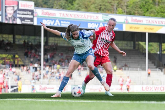 Lilla Turanyi Lilla Turanyi, Bayer 04 Leverkusen, 24, in a tackle with Luca Birkholz, SC Freiburg, 23, Germany, soccer, Google Pixel Women s Bundesliga, Matchday 5, 2026–2027, SC Freiburg vs. Bayer 04 Leverkusen, September 20, 2026, Dreisamstadion, Freiburg, Dreisamstadion, Baden-Württemberg, Germany Copyright: xArnexAmbergx