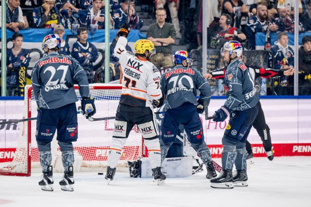 Linus Froeberg (Loewen Frankfurt, 71) celebrates the goal by Cameron Brace (Loewen Frankfurt, 86; not pictured) to make it 1–2; Veit Oswald (EHC Red Bull Munich, 27), Maximilian Daubner (EHC Red Bull Munich, 70) and Brady Ferguson (EHC Red Bull Munich, 12) are understandably frustrated. GER, EHC Red Bull Munich vs. Löwen Frankfurt Ice Hockey, DEL, 2026–2027 Season, Matchday 4, September 27, 2026. Photo: HMB Media, Heike Feiner Copyright: HMBxMedia HeikexFeiner