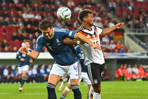 v re Bambase CONTE GER, Ntinos MAVROPANOS Greece, Action, Tackle, Soccer Nations League Group Stage, Group B, Matchday 2, Germany (GER) vs. Greece (GRE) 0–1, on September 27, 2026, WWK ARENA AUGSBURG