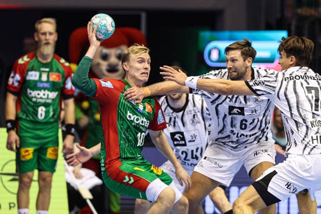 Gisli Kristjansson, SC Magdeburg (10), against Harald Reinkind, M, THW Kiel (6), and Julian Köster, THW Kiel (7). Handball Bundesliga Season 2026–2027: SC Magdeburg vs. THW Kiel at the GETEC Arena in Magdeburg. Action, handball,Germany, September 30, 2026