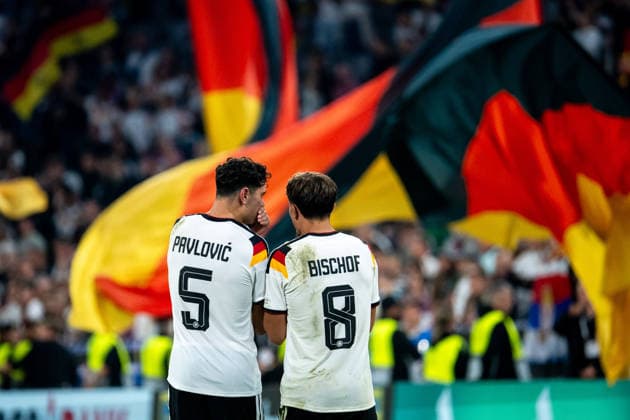 October 1, 2026, GER, Soccer, Men s, UEFA Nations League International Match, League A, Matchday 3, Germany vs. Serbia Aleksandar Pavlovic (Germany), 5, Tom Bischof (Germany), 8, with fans in the background holding flags, Munich, Allianz Arena, Bavaria, Germany Copyright: xNordphoto Memmlerx