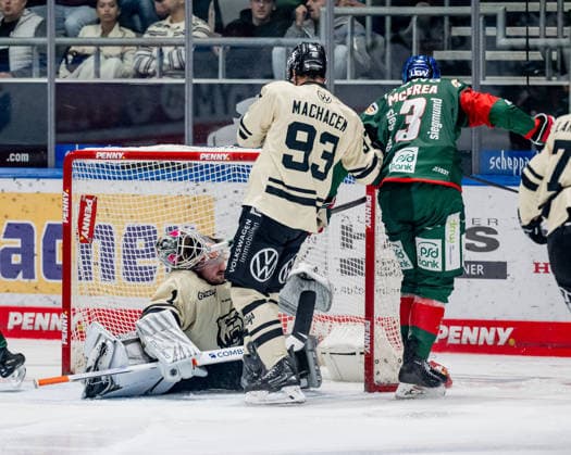 Alec McCrea of the Augsburger Panther, 03, swats the helmet off the head of Dustin Strahlmeier, goaltender for the Grizzlys Wolfsburg, 01; behind them is Spencer Machacek of the Grizzlys Wolfsburg, 93 GER, Augsburger Panther vs. Grizzlys Wolfsburg, ice hockey, DEL, 2026–2027 season, Matchday 4, October 2, 2026. Photo: HMB Media, Heike Feiner Copyright: HMBxMedia HeikexFeiner