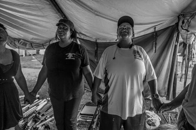 July 19, 2015 - San Diego, CA, United States - At the conclusion of the San Diego homeless veterans stand down sponsored by Veterans Village of San Diego, Paula Anderson, left and Patricia Butts, right, hold hands during the final serenity prayer...When Paula Anderson, left, told her US Army commander that she had been drugged and raped by a fellow soldier, she was shipped off to Korea. Her US Army career lasted six years but her military sexual trauma has followed her for 20 years. After spending 17 months in jail, she has been homeless since February 2015.  In the little bit of time Iâ€⠢ve been homeless it takes the good out of me. I donâ€⠢t care how I look. I think I look ugly. Pretty soon you use drugs to comfort yourself. Thatâ€⠢s part of being homeless.†She says she has made bad choices but started to develop when she watched Oprah.  When you are o - ZUMAcv4_