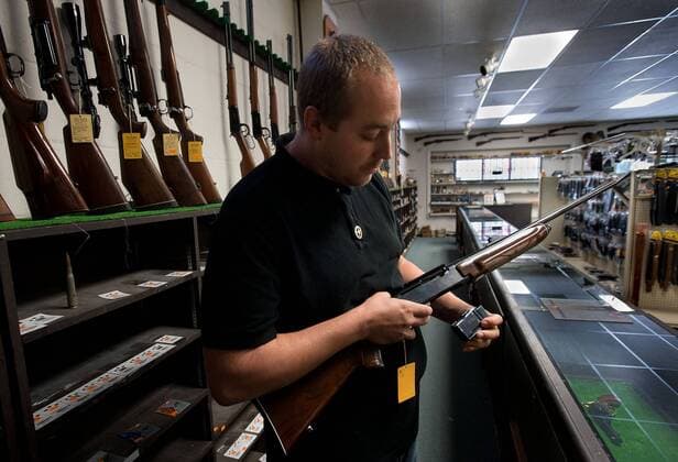 June 12, 2013 - Sacramento, California, USA - Gun shop owner Adam Fahlbusch at the Big Horn Gun Shop in El Dorado on Wednesday, June 12, 2013. Concerned that legislation would restrict access to firearms, California residents bought guns in 2012 at a rate never seen before, new figures from the California Department of Justice show. The state s gun dealers sold 815,000 guns last year -- a gun sold, on average, every 45 seconds. That s an increase of 216,000, or 35 percent, from 2012. The trend held true for the Sacramento region, where 75,000 guns were sold last year. Gun dealers say sales are still brisk due to gun control efforts by the state legislature. Fahlbusch saw a big increase in gun sales at his store in 2012, particularly toward the end of the year as talk of more gun control reached a fever pitch. - ZUMAs76