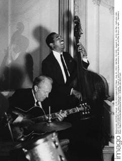 Aug. 21, 2013 - Del Mar, CA, USA - August 21, 2013, Del Mar, California, USA_ COPY OF PHOTOGRAPH by Helen Montgomery Drysdale- Photo of performing jazz musicians Herb Ellis, left, and Ray Brown, at right. _Mandatory Photo - ZUMAs44
