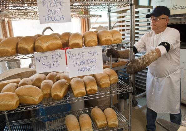 August 31, 2017 - U.S. - Marla Brose -- Pratt Morales, owner of Golden Crown Panaderia, moves shelves of freshly baked bread that are bound for Hurricane Harvey victims, Thursday, August 31, 2017, inside his bakery in Albuquerque, N.M. Morales and other bakers started making about 1,000 loaves of bread for the Houston-bound delivery Wednesday morning. They baked through the night. Morales went home around 4 a.m. and took a nap, he said. The bread is scheduled to be picked up Thursday evening and delivered to Houston. U.S. - ZUMAab1_ 20170831_zaf_ab1_001 Copyright: xAlbuquerquexJournalx
