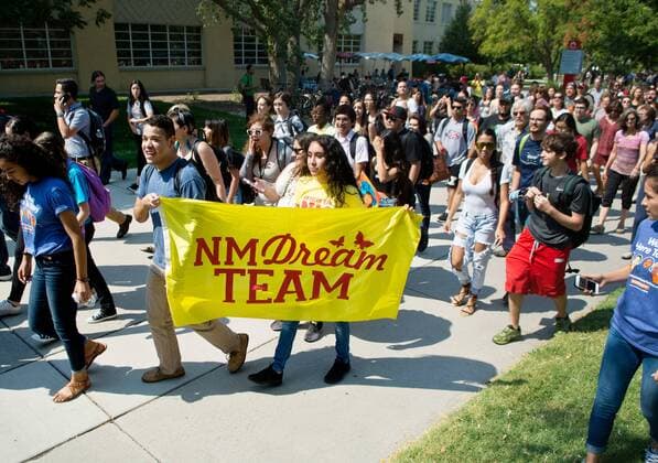 September 5, 2017 - U.S. - Marla Brose -- Hundreds of University of New Mexico students, staff and faculty, including Anacaren Ruiz, third from left, and Jorge Guerrero, second from left, both UNM seniors, who hold a NM Dream Team flag, march around campus, chanting in support of immigrants and DACA students who may be affected by President Trump s proposed policy changes, Tuesday, Sept. 5, 2017, in Albuquerque, N.M. U.S. - ZUMAab1_ 20170905_zaf_ab1_024 Copyright: xAlbuquerquexJournalx