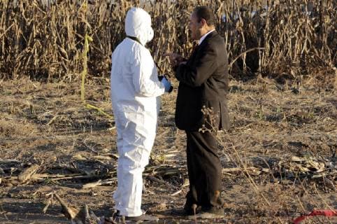 (181225) -- PUEBLA, Dec. 25, 2018 -- A forensic member works at the helicopter crash site in Coronango, Puebla, Mexico, Dec. 24, 2018. The governor of Mexico s central state of Puebla, Martha Erika Alonso, and her husband Rafael Moreno Valle, ex-governor of the state, were killed in a helicopter crash on Monday, the head of the National Action Party Marko Cortes confirmed. ) (rtg) MEXICO-PUEBLA-ACCIDENT-HELICOPTER CRASH STR