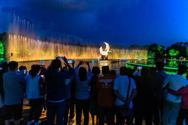 July 19, 2019 - Jilin, Jilin, China - Jilin, CHINA-The musical fountain lighting show in Jingyuetan national forest park in Changchun, capital of northeast China s Jilin province, opens on July 1, 2019.Music fountain waterscape light show is located in the goddess square at the main entrance of jingyuetan, taking the statue of the goddess of the clear moon as the central point, composed of fountain, LED beam light, LED full color tree light, LED full color wash wall light, pattern light, etc., which can combine hundreds of action forms. Jilin China - ZUMAs145 20190719_zaa_s145_062 Copyright: xChixXiaoweix