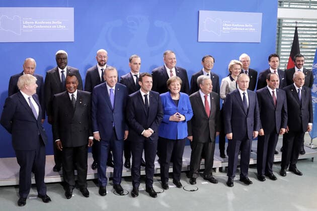 BERLIN, GERMANY - JANUARY 19, 2020: UK Prime Minister Boris Johnson, an unidentified official, Turkey’s President Recep Tayyip Erdogan, France’s President Emmanuel Macron, Germany’s Chancellor Angela Merkel, UN Secretary General Antonio Guterres, Russia s President Vladimir Putin, Egypt s President Abdel Fattah el-Sisi (from L front), US Secretary General Mike Pompeo (5th L back), European Commission President Ursula von der Leyen (4th R back), and Italy s Prime Minister Giuseppe Conte (R back) pose for a group photograph during a photo session at an international summit on Libya; the summit is to discuss efforts to achieve peace and reconciliation between Libya s government and General Haftar. Mikhail Metzel TASS TS0CAC4C