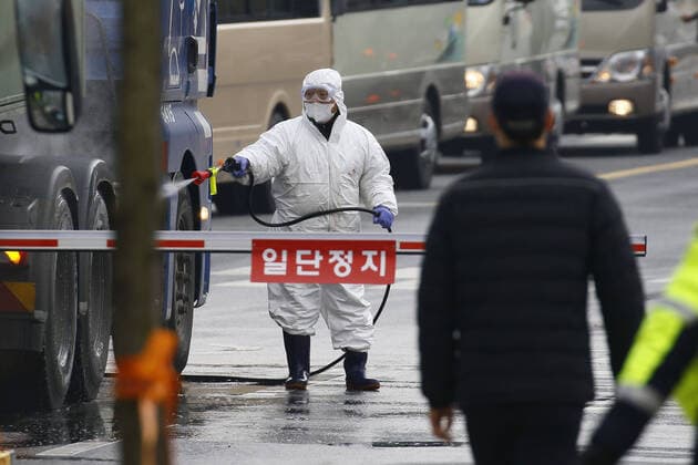 January 31, 2020, Jincheon, CHUNGBUK, SOUTH KOREA: January 31, 2020-Jin Cheon, South Korea- An official disinfects a road near a state facility in Jincheon, some 90 kilometers southeast of Seoul, on Jan. 31, 2020, before the arrival of South Korean evacuees from the coronavirus-hit Chinese city of Wuhan. About 370 South Korean evacuees from the coronavirus-hit Chinese city of Wuhan headed in 36 police buses for two government-designated accommodations in central parts of the nation Friday after arriving at Gimpo International Airport in western Seoul in the morning. The first batch of 368 South Korean residents of Wuhan, who landed in Gimpo aboard a chartered Korean Air plane, will be asked to stay at two government-run facilities the National Human Resources Development Institute in Jincheon, North Chungcheong Province, and the Police Hu - ZUMAr168 20200131_zap_r168_018 Copyright: xRyuxSeung-Ilx