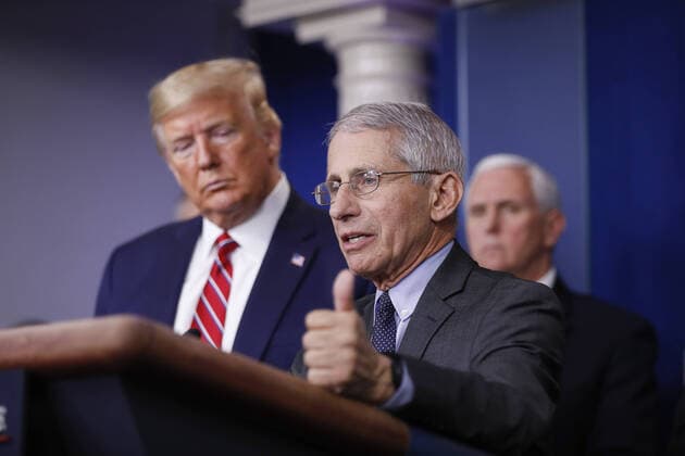 Anthony Fauci, director of the National Institute of Allergy and Infectious Diseases, speaks as U.S. President Donald Trump, left, and U.S. Vice President Mike Pence, right, listen during a Coronavirus Task Force news conference in the briefing room of the White House in Washington, DC on Friday, March 20, 2020. Americans will have to practice social distancing for at least several more weeks to mitigate U.S. cases of Covid-19, Anthony S. Fauci of the National Institutes of Health said today. WAX20200320930 ALxDRAGO