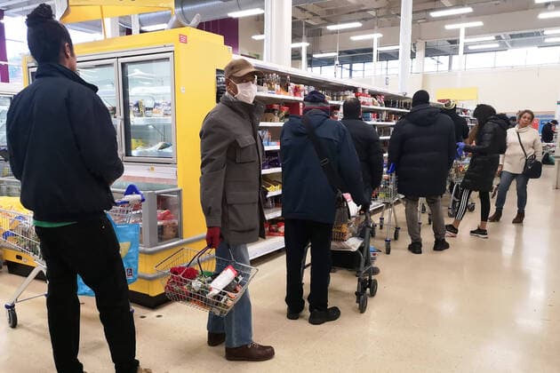 (200320) -- LONDON, March 20, 2020 (Xinhua) -- People go shopping in a Tesco supermarket in London, Britain, on March 20, 2020. Cafes, bars, pubs and restaurants must close from Friday night across Britain in a bid to contain the spread of COVID-19 outbreak, British Prime Minister Boris Johnson said Friday. As of 9 a.m. local time (0900 GMT) Friday, the number of confirmed COVID-19 cases in Britain reached 3,983, according to UK s Department of Health and Social Care. As of 1 p.m. (1300 GMT), 177 patients who tested positive for COVID-19 have died. (Photo by Joe Newman Xinhua) BRITAIN-LONDON-COVID-19-SHOPPING