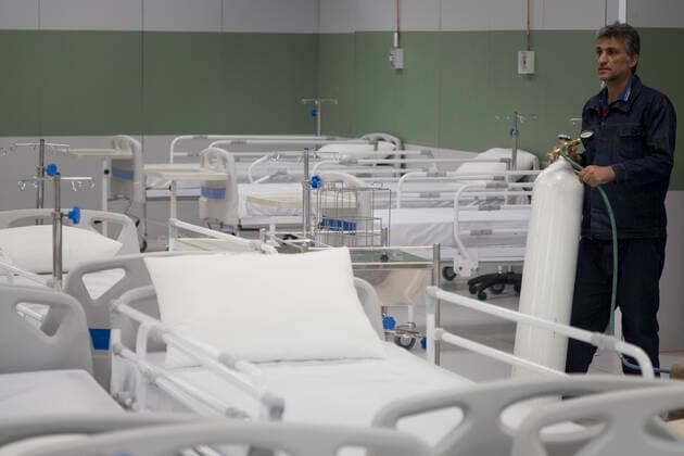 March 21, 2020, Tehran, Iran: Iranian workers set a temporary established emergency hospital in a part of the world s largest shopping mall complex called Iran Mall , to treat patients infected with the COVID-19 disease, caused by the SARS-CoV-2 coronavirus, in the northwest of the capital of Tehran, Iran. Iran is one of the countries most affected by the devastating pandemic of the coronavirus. According to the latest report by the Ministry of Health, there are at least 20,610 confirmed cases of coronavirus infections and 1,556 people have died from the virus throughout Iran. Tehran Iran - ZUMAf146 20200321_zip_f146_003 Copyright: xRouzbehxFouladix