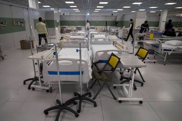 March 21, 2020, Tehran, Iran: Iranian workers set a temporary established emergency hospital in a part of the world s largest shopping mall complex called Iran Mall , to treat patients infected with the COVID-19 disease, caused by the SARS-CoV-2 coronavirus, in the northwest of the capital of Tehran, Iran. Iran is one of the countries most affected by the devastating pandemic of the coronavirus. According to the latest report by the Ministry of Health, there are at least 20,610 confirmed cases of coronavirus infections and 1,556 people have died from the virus throughout Iran. Tehran Iran - ZUMAf146 20200321_zip_f146_018 Copyright: xRouzbehxFouladix