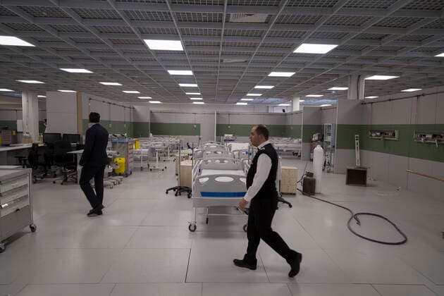 March 21, 2020, Tehran, Iran: Iranian workers set a temporary established emergency hospital in a part of the world s largest shopping mall complex called Iran Mall , to treat patients infected with the COVID-19 disease, caused by the SARS-CoV-2 coronavirus, in the northwest of the capital of Tehran, Iran. Iran is one of the countries most affected by the devastating pandemic of the coronavirus. According to the latest report by the Ministry of Health, there are at least 20,610 confirmed cases of coronavirus infections and 1,556 people have died from the virus throughout Iran. Tehran Iran - ZUMAf146 20200321_zip_f146_027 Copyright: xRouzbehxFouladix