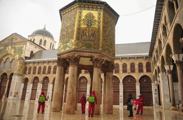 March 21, 2020, Damascus, Damascus, Syrian Arab Republic: Syrian workers disinfect the Great Umayyad Mosque, as a preventive measure amid fears of the spread of the coronavirus, in Damascus, Syria, on March 21, 2020. Even though no cases of coronavirus Covid-19 have yet been reported in the city, some people prefer to take precautionary measures Damascus Syrian Arab Republic - ZUMAap3_ 20200321_zaf_ap3_066 Copyright: xOmarxEstwanix