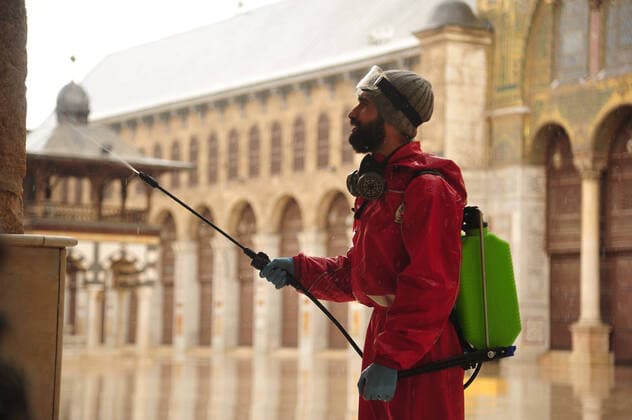 March 21, 2020, Damascus, Damascus, Syrian Arab Republic: Syrian workers disinfect the Great Umayyad Mosque, as a preventive measure amid fears of the spread of the coronavirus, in Damascus, Syria, on March 21, 2020. Even though no cases of coronavirus Covid-19 have yet been reported in the city, some people prefer to take precautionary measures Damascus Syrian Arab Republic - ZUMAap3_ 20200321_zaf_ap3_071 Copyright: xOmarxEstwanix
