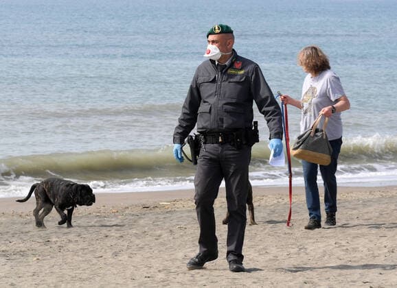 (200321) -- ROME, March 21, 2020 (Xinhua) -- A policeman is seen in Ostia, Rome, Italy, March 21, 2020. Italy reported 6,557 new cases of coronavirus on Saturday, raising the total to 53,578 since the pandemic first broke out in its north on Feb. 21, according to the latest data provided by the Civil Protection Department managing the COVID-19 emergency. (Photo by Elisa Lingria Xinhua) ITALY-ROME-OSTIA-COVID-19-CASES