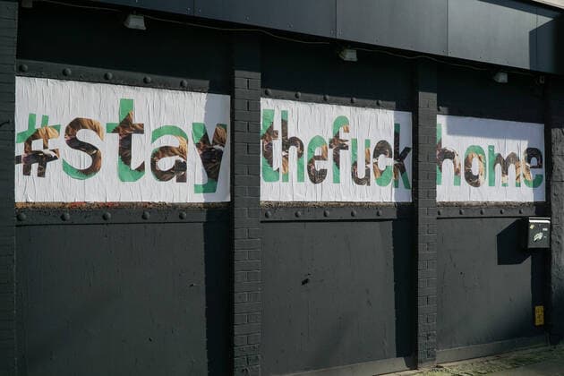 To contain the coronavirus, business closures, restrictions and contact restrictions have been ordered and curfews are being discussed, the photo shows a banner, banner, poster, notice, writing on a building with the words, hashtag stay the fuck home, stay at home, stayathome, stay at home, stay at home, contact ban, contact ban, curfew, 25 03 2020, Bremen Germany , News, Feature, Coronavirus Bre xobx