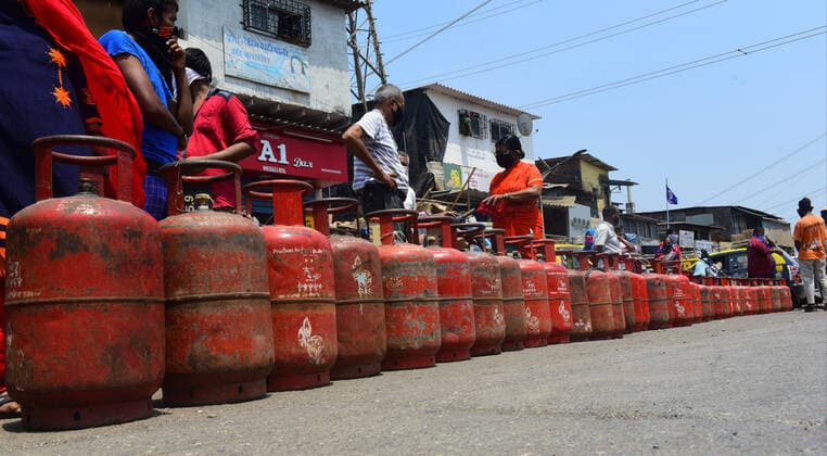 MUMBAI, INDIA - MARCH 25: Mumbaikar stand in que for Gas Cylinder at Barkat ali naka Antop Hill during restrictions on citizens movement on account of section 144 due to COVID 19 Pandemic, on March 25, 2020 in Mumbai, India. Prime Minister Narendra Modi on Tuesday announced complete lockdown of the entire country, as part of the government?s stringent efforts to tackle coronavirus disease Covid-19. This lockdown will be in place for 21 days and more stringent than Janta Curfew. Although, ration shops, groceries, fruits and vegetable shops, dairy and milk booths, meat and fish shops, animal fodder will remain open during the 21-day lockdown. (Photo by Vijayanand Gupta Hindustan Times ) India Goes Into 21 Day Lockdown Due To Coronavirus COVID 19