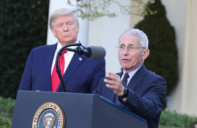March 30, 2020, Washington, District of Columbia, USA: US President Donald J. Trump listens as Anthony Fauci, director of the National Institute of Allergy and Infectious Diseases (R) speaks during the Coronavirus Task Force press briefing on the coronavirus and COVID-19 pandemic, in the Rose Garden at the White House, in Washington, DC, USA, 30 March 2020 Washington USA - ZUMAs152 20200330_zaa_s152_047 Copyright: xMichaelxReynoldsx
