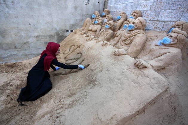 April 3, 2020, Gaza City, Gaza Strip, Palestinian Territory: A Palestinian artist Rana el-Ramlawi, 23, creates a sand sculpture stay home during awareness campaign about the spread of coronavirus disease (COVID-19), at her house Gaza city, on April 3, 2020. The United Nations has warned that a COVID-19 outbreak in Gaza could be disastrous, given the high poverty rates and weak health system in the coastal strip under Israeli blockade since 2007. Authorities in Gaza have said that more than 2,700 Palestinians are in home-isolation, mostly people who had returned from Egypt Gaza City Palestinian Territory - ZUMAap3_ 20200403_zaf_ap3_040 Copyright: xMahmoudxAjjourx