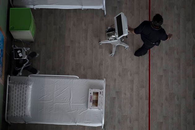 April 4, 2020, Tehran, Iran: A view of a temporary established emergency hospital in a part of the world s largest shopping mall complex called Iran Mall , to treat patients infected with the COVID-19 disease, caused by the SARS-CoV-2 coronavirus, in the northwest of the capital of Tehran, Iran. Due to the new type of coronavirus pandemic, the fairgrounds and gyms are temporarily turned into hospitals in the country. Iran Mall has turned into COVID-19 convalescent care center since the virus outbreak, equipped with about 1000 hospital beds, 20 ventilators, monitoring systems, and other needed equipment. Each day the center hosts 20 recovered ones who discharged from hospitals, and the patients are kept in the second round of quarantine to be up and about. Those in charge are estimating the beds increase to 3000. Tehran Iran - ZUMAf146 20200404_zip_f146_043 Copyright: xRouzbehxFouladix