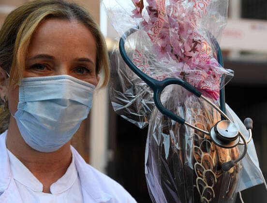 (200412) -- ROME, April 12, 2020 (Xinhua) -- Doctor Monica Carfora poses with an Easter Egg during a break at Santo Spirito Hospital in Rome, Italy, April 12, 2020. The coronavirus pandemic has claimed 19,468 lives in locked-down Italy, bringing the total number of infections, fatalities and recoveries so far to 152,271, according to the latest data released by the country s Civil Protection Department on Saturday. (Photo by Alberto Lingria Xinhua) ITALY-ROME-COVID-19-MEDICAL WORKER