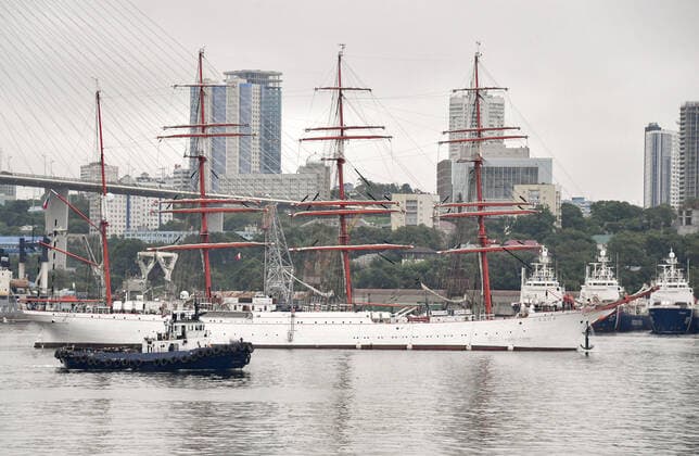 VLADIVOSTOK, RUSSIA - JULY 14, 2020: The Sedov barque in the Golden Horn Bay. Russia s barque Sedov, a participant in a round-the-world expedition marking the 200th anniversary of the First Russian Antarctic Expedition by Fabian von Bellingshausen and Mikhail Lazarev and the 75th anniversary of the victory over Nazi Germany in WWII, has set off from the port of Vladivostok for a month mission in the Sea of Japan. The Sedov barque, originally built as a German cargo ship and named Magdalene Vinnen II, was launched in 1921 in Kiel, Germany. During WWII, the vessel formed part of the German reserve fleet; under the Potsdam Declaration, in December 1945, the vessel was handed over to the Soviet Union and renamed to Sedov honoring Russian Arctic TS0E00D6