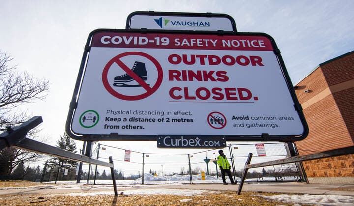 (210116) -- ONTARIO, Jan. 16, 2021 -- A security officer wearing a face mask is seen on duty outside a closed outdoor rink in Vaughan, Ontario, Canada, on Jan. 16, 2021. Canada s COVID-19 cases surpassed 700,000 on Saturday morning, with the total hitting 700,988, including 17,847 deaths, according to CTV. (Photo by Xinhua) CANADA-ONTARIO-COVID-19-CASES ZouxZheng