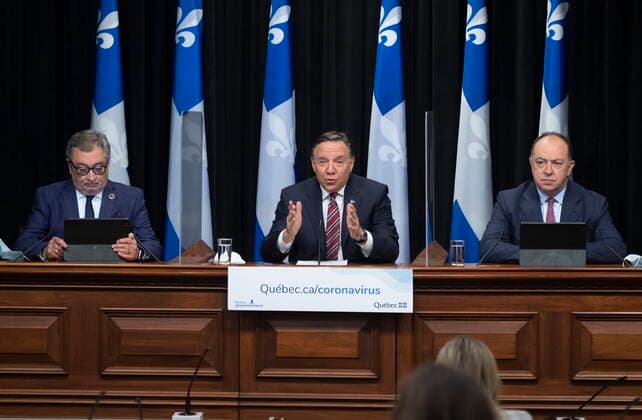 February 2, 2021, Quebec, PQ, Canada: Quebec Premier Francois Legault outlines new measures during a news conference on the COVID-19 pandemic, Tuesday, February 2, 2021 at the legislature in Quebec City. Legault is flanked by Horacio Arruda, Quebec director of National Public Health, left, and Christian Dube. Quebec Canada - ZUMAc35_ 20210202_zaf_c35_050 Copyright: xJacquesxBoissinotx