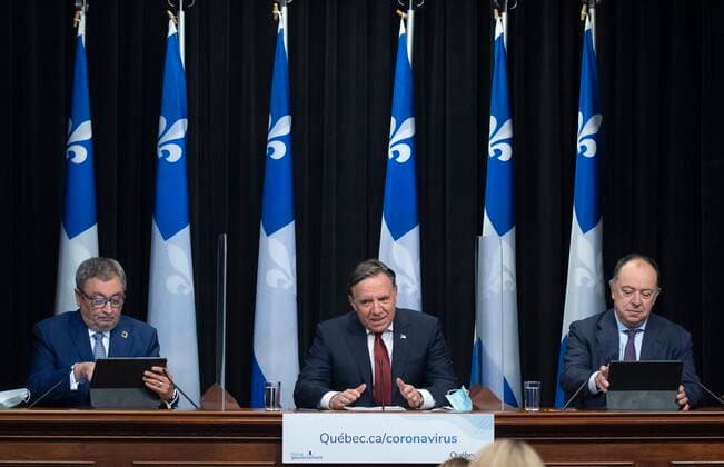 February 9, 2021, QUEBEC, PQ, Canada: Quebec Premier Francois Legault speaks during a news conference on the COVID-19 pandemic, Tuesday, February 9, 2021 at the legislature in Quebec City. Legault is flanked by Horacio Arruda, Quebec director of National Public Health, left, and Quebec Health Minister Christian Dube. QUEBEC Canada - ZUMAc35_ 20210209_zaf_c35_017 Copyright: xJacquesxBoissinotx