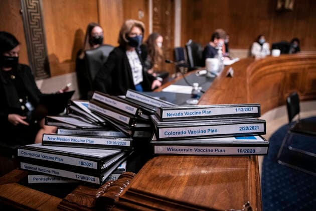 February 23, 2021, Washington, District of Columbia, USA: Binders of coronavirus vaccine plans are seen during the Senate Health, Education, Labor and Pensions Committee confirmation hearing of Xavier Becerra, secretary of Health and Human Services (HHS) nominee for U.S. President Joe Biden, in Washington, D.C., U.S., on Tuesday, Feb. 23, 2021. Biden s pick to lead HHS gives him a fierce defender of Democratic causes but one without hands-on experience leading a massive federal agency in the middle of an unprecedented public health crisis Washington USA - ZUMAs152 20210223_zaa_s152_354 Copyright: xSarahxSilbigerx-xPoolxViaxCnpx