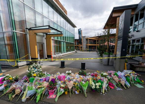 March 28, 2021, North Vancouver, BC, Canada: Flowers are seen at a makeshift memorial outside of the Lynn Valley Library in Lynn Valley in North Vancouver, B.C., Sunday, March 28, 2021. A 28-year-old man was charged Sunday with second-degree murder in a stabbing rampage that left a young woman dead and injured six others in and around a library in North Vancouver, B.C., a day earlier. North Vancouver Canada - ZUMAc35_ 20210328_zaf_c35_111 Copyright: xJonathanxHaywardx