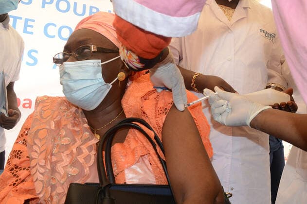 (210331) -- BAMAKO, March 31, 2021 -- A woman receives the COVID-19 vaccine in Bamako, Mali, on March 31, 2021. Malian Minister of Health and Social Development Fanta Siby received Wednesday her first dose of COVID-19 vaccine, which symbolized the official kickoff of Mali s COVID-19 vaccination campaign. During this first phase of the vaccination campaign, according to the minister, a total of 21,406 health workers will be vaccinated in Bamako, epicenter of the pandemic in this West African country. (Photo by Xinhua) MALI-BAMAKO-COVID-19-VACCINATION HabibxKouyate