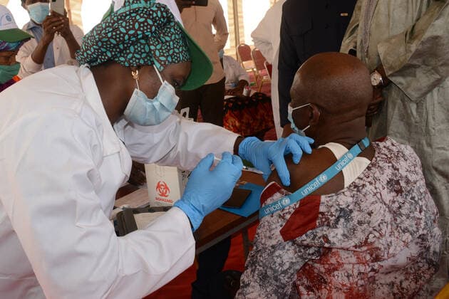 (210331) -- BAMAKO, March 31, 2021 -- A man receives the COVID-19 vaccine in Bamako, Mali, on March 31, 2021. Malian Minister of Health and Social Development Fanta Siby received Wednesday her first dose of COVID-19 vaccine, which symbolized the official kickoff of Mali s COVID-19 vaccination campaign. During this first phase of the vaccination campaign, according to the minister, a total of 21,406 health workers will be vaccinated in Bamako, epicenter of the pandemic in this West African country. (Photo by Xinhua) MALI-BAMAKO-COVID-19-VACCINATION HabibxKouyate
