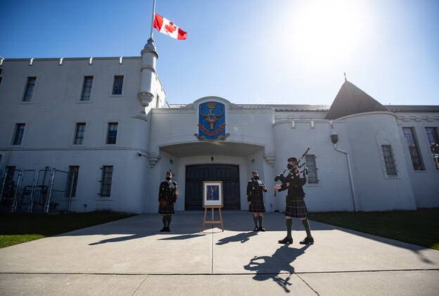 April 17, 2021, Vancouver, BC, Canada: Pipe Major Dan Bell, front right, plays the piper s lament in honour of Britain s Prince Philip as Commanding Officer Lt. Col Ed Haverstock, back left, and Regimental Sgt. Major Rob Deans stand at attention while the Canadian flag flies at half mast outside The Seaforth Highlanders of Canada armoury in Vancouver, on Saturday, April 17, 2021. Prince Philip was the Colonel-in-Chief of The Seaforth Highlanders of Canada, an Army Reserve infantry regiment of 39 Canadian Brigade Group garrisoned in Vancouver. Vancouver Canada - ZUMAc35_ 20210417_zaf_c35_035 Copyright: xDarrylxDyckx