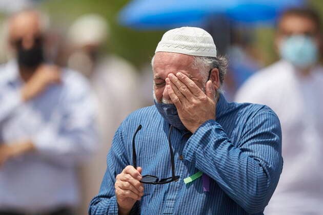 June 12, 2021, London, on, Canada: A man wipes away a tear during the funeral service for the four victims of a deadly vehicle attack in London, Ont., on Saturday, June 12, 2021. Talat Afzaal, 74, her son Salman Afzaal, 46, his wife Madiha Salman, 44, and their 15-year-old daughter Yumna Salman all died last Sunday night while out for a walk after a man in a truck drove them down in what police have called a premeditated attack because they were Muslim. London Canada - ZUMAc35_ 20210612_zaf_c35_084 Copyright: xGeoffxRobinsx