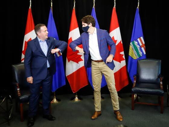 July 7, 2021, Calgary, ab, Canada: Prime Minister Justin Trudeau, right, elbow bumps with with Alberta Premier Jason Kenney as the two meet in Calgary, Alta., Wednesday, July 7, 2021. Calgary Canada - ZUMAc35_ 20210707_zaf_c35_012 Copyright: xJeffxMcintoshx